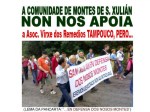 Directivos e/ou ex-directivos da Comunidade de Montes de San Xulián portando unha pancarta co lema “EN DEFENSA DOS NOSOS&nbsp;MONTES”.